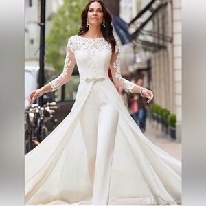 Elegant white wedding pantsuit with lace with a detachable flowing overskirt.
